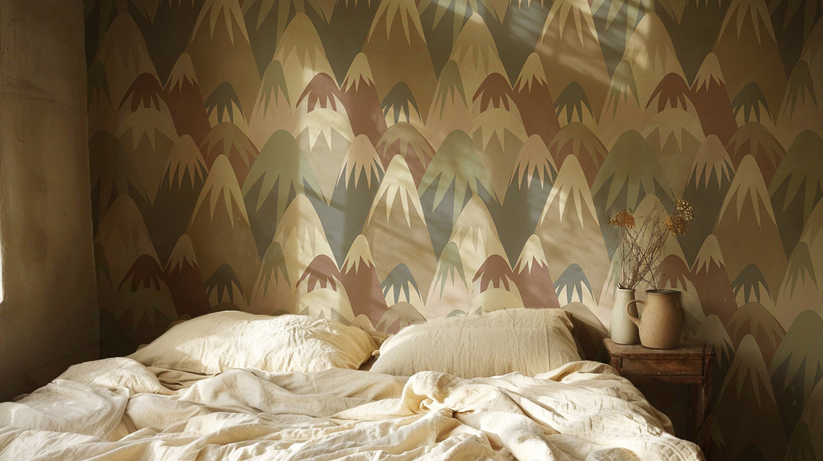 Retro mountain wallpaper featuring layered geometric mountain peaks in muted sage green, terracotta, taupe, cream, and brown tones, creating a playful mid-century modern landscape design in bedroom