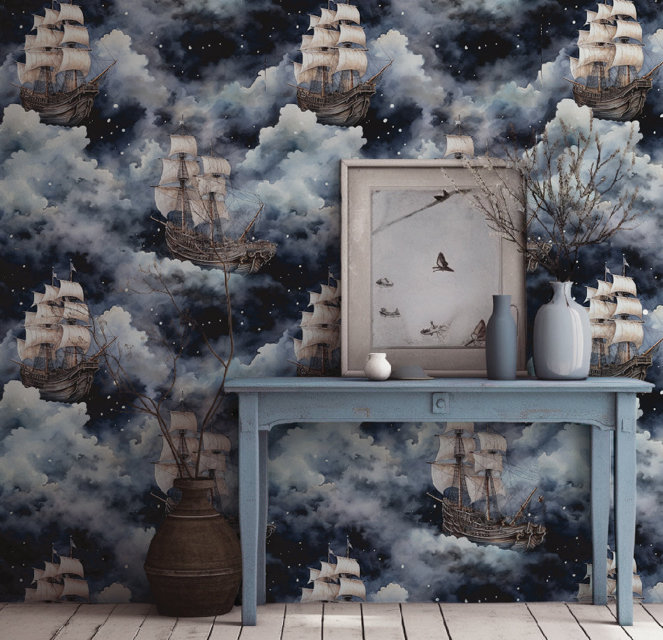 Dark nautical wallpaper with vintage sailing ships floating through dramatic navy blue and grey clouds in living room.
