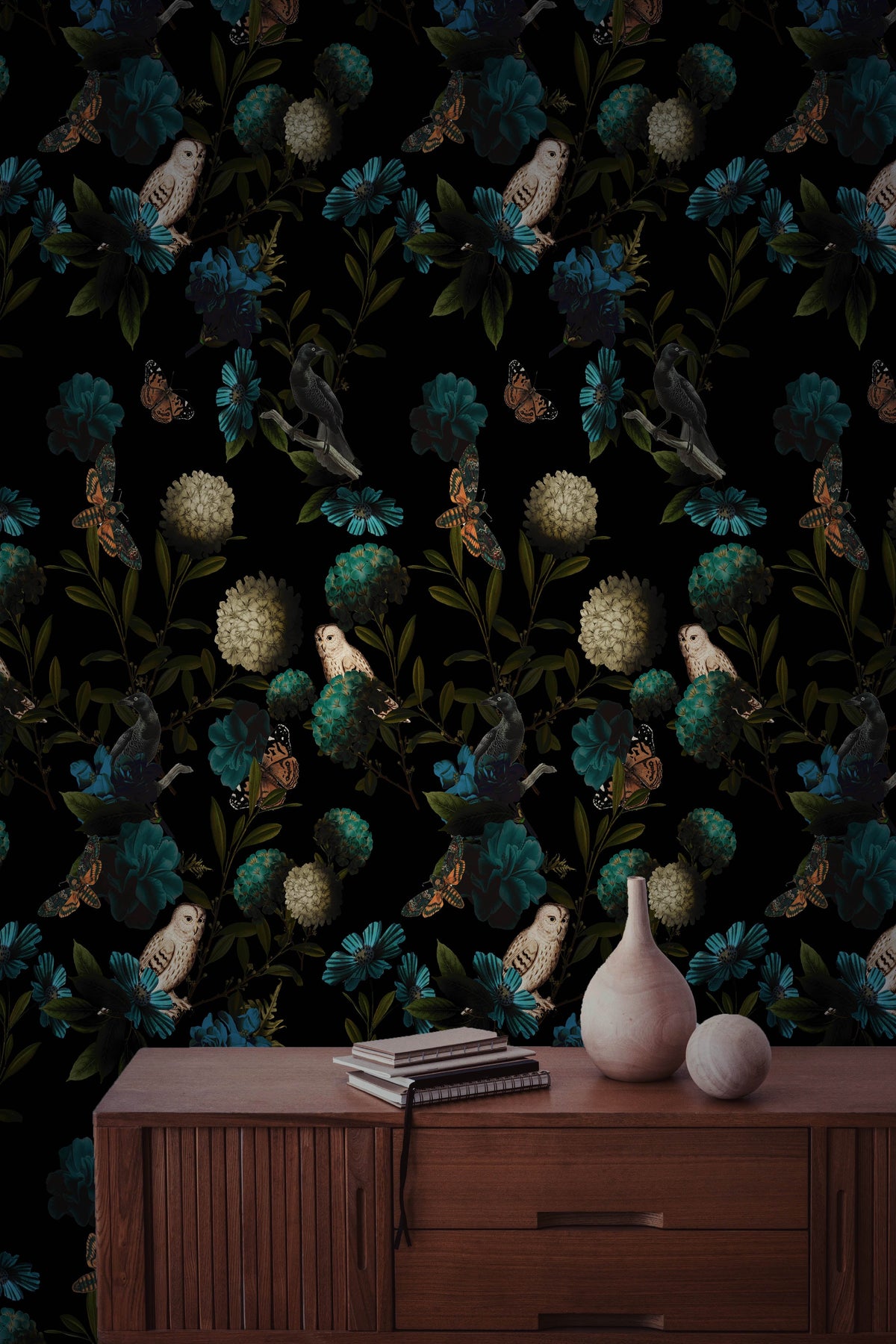 Dark owl and floral wallpaper with teal blue flowers, butterflies, birds and deep green foliage on a black background in office.