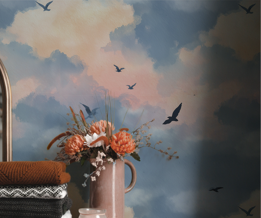 Dreamy evening sky wallpaper with soft blue and peach clouds and flying birds On wall