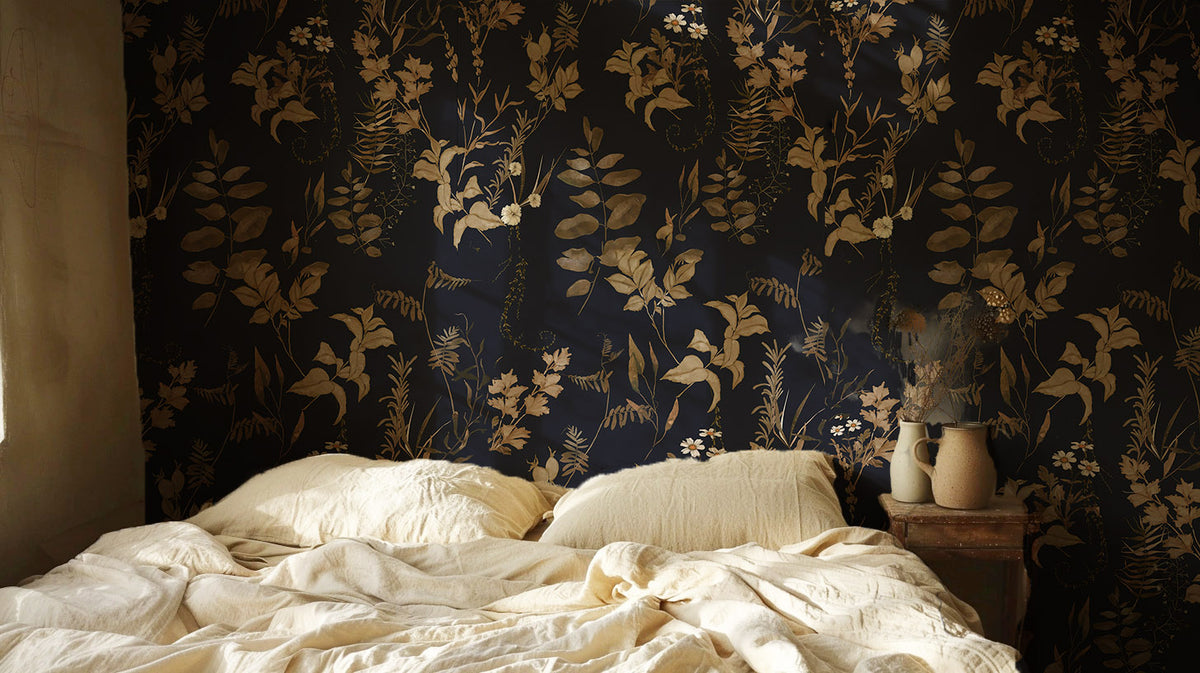Dark floral wallpaper with vintage botanical leaves, delicate white wildflowers and warm brown foliage on a deep navy blue background in bedroom.