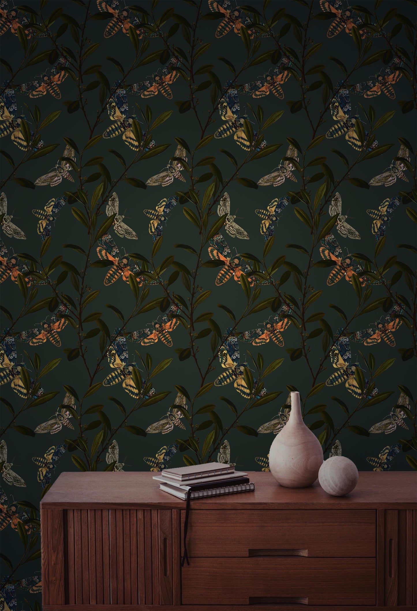 Peel and stick wallpaper with colorful moths and olive branches on a dark green background for folklore-inspired Cottagecore interiors