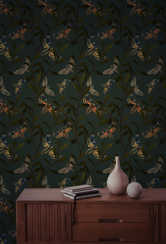 Peel and stick wallpaper with colorful moths and olive branches on a dark green background for folklore-inspired Cottagecore interiors