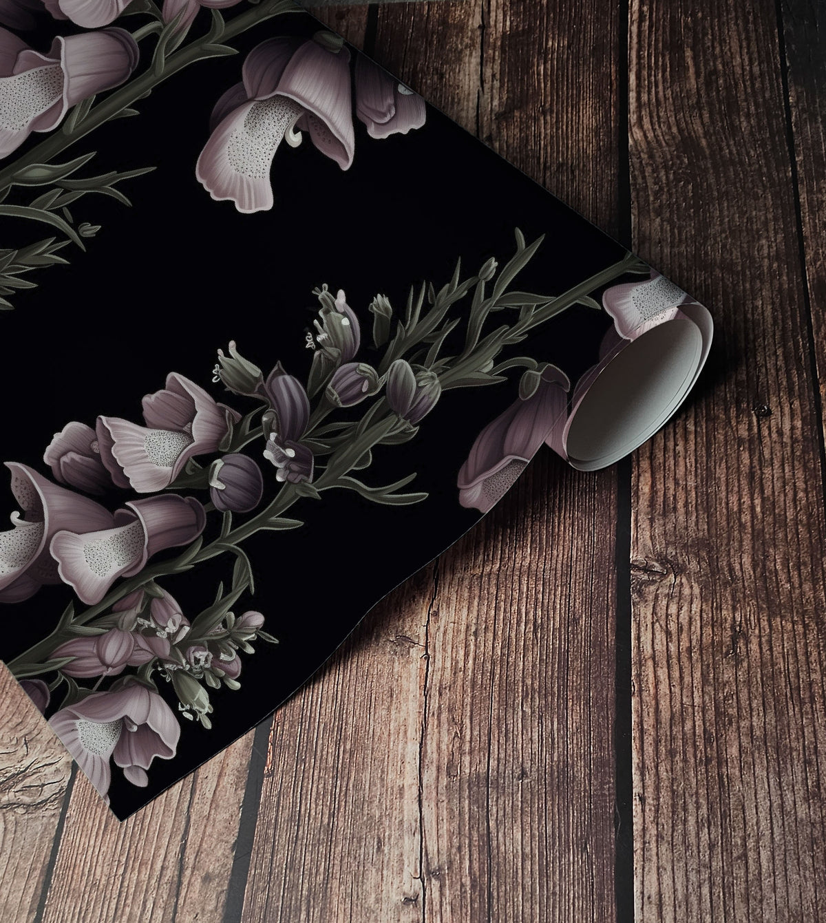 Dark foxglove floral wallpaper with dusty mauve and purple bell-shaped flowers, muted green stems and botanical details on a black background up close.