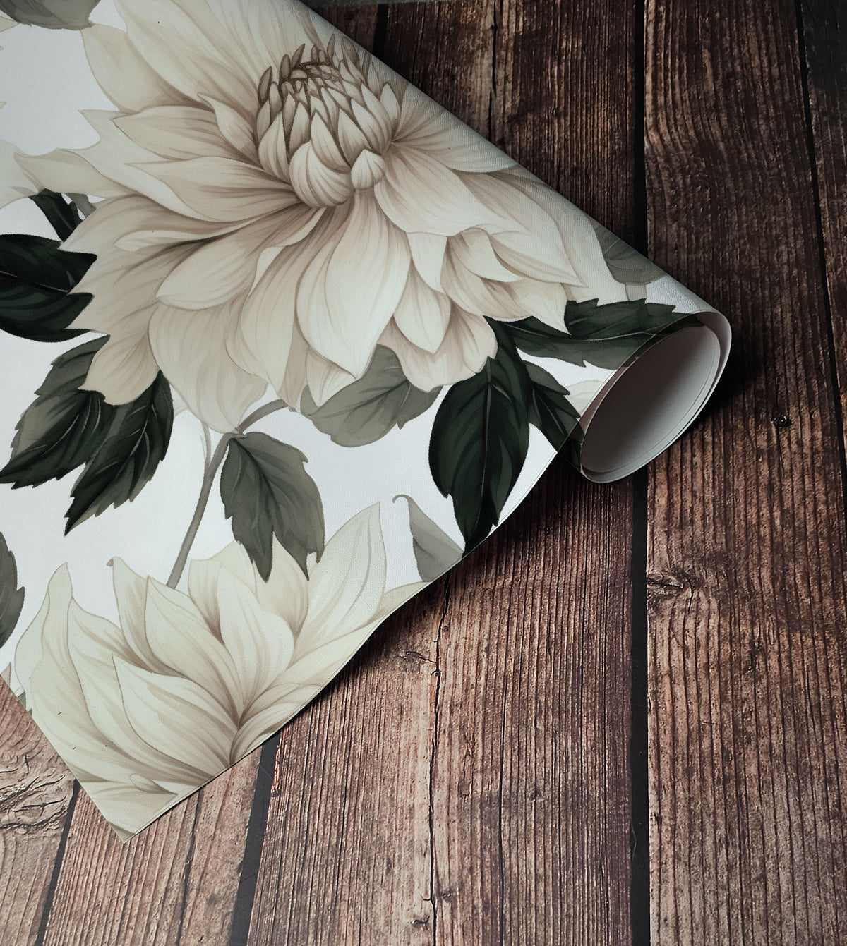 Large cream dahlia wallpaper with oversized floral blooms and deep green foliage on a soft white background up close