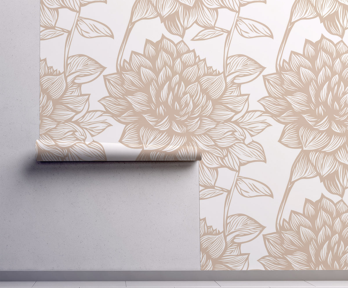 Beige and cream botanical wallpaper with oversized hand-drawn leaves and floral foliage in a soft neutral colour palette on wall.