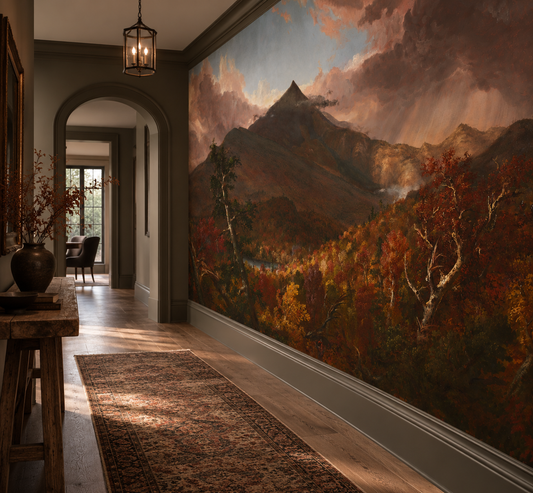 Moody mountain landscape mural with dramatic pink storm clouds, dark mountain peaks and richly coloured autumn forests in hallway