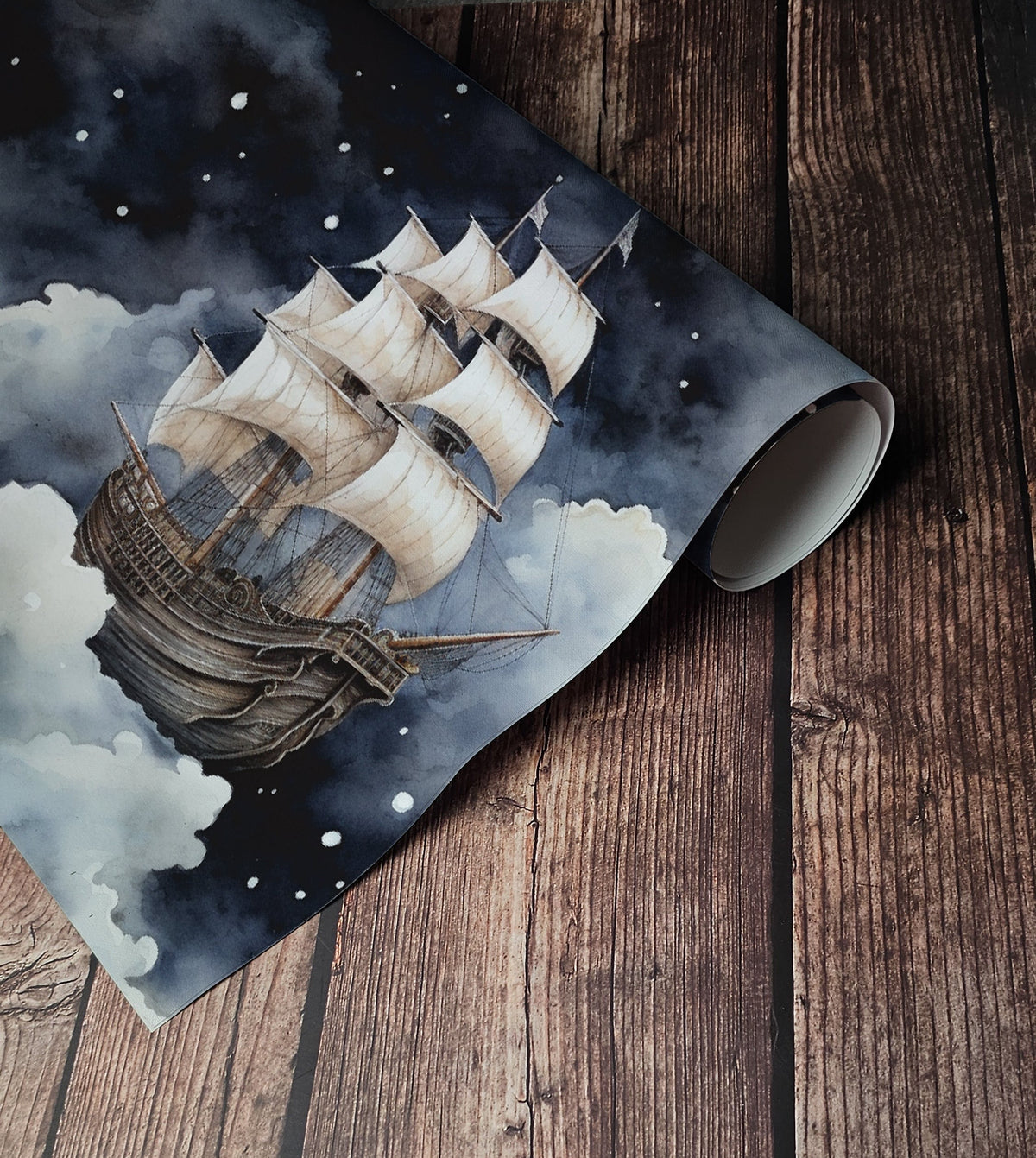 Dark nautical wallpaper with vintage sailing ships floating through dramatic navy blue and grey clouds up close