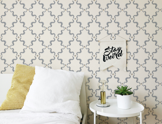 Snake skeleton wallpaper with repeating skeletal serpents and small bees, vintage peel and stick wallpaper pattern in bedroom