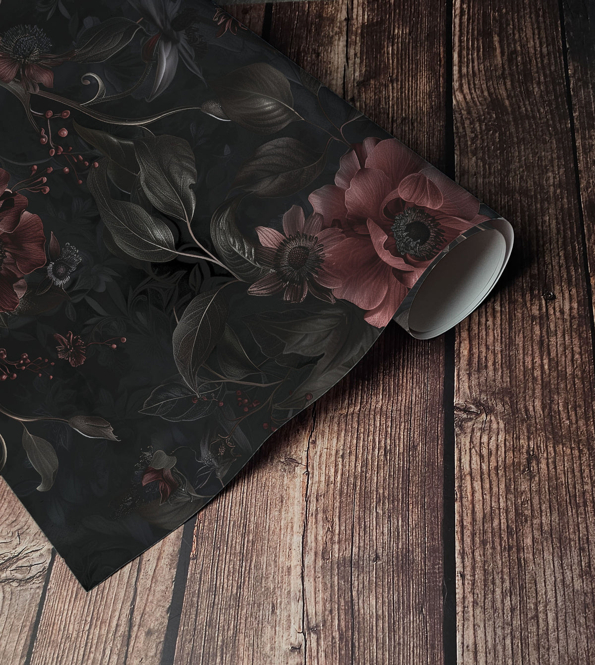 Dark moody floral wallpaper with deep burgundy flowers, black foliage and trailing vines on a charcoal background. on roll