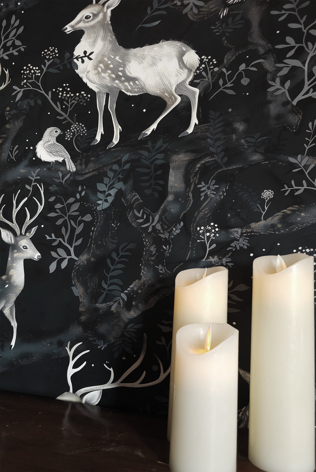 Dark woodland wallpaper featuring graceful deer, owls, and birds among twisting forest branches and soft botanical details on a deep moody background up close
