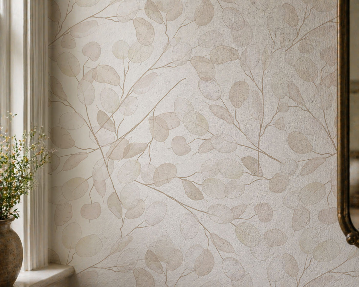 Neutral botanical wallpaper with delicate translucent round leaves and fine branching stems in soft beige and cream tones on wall