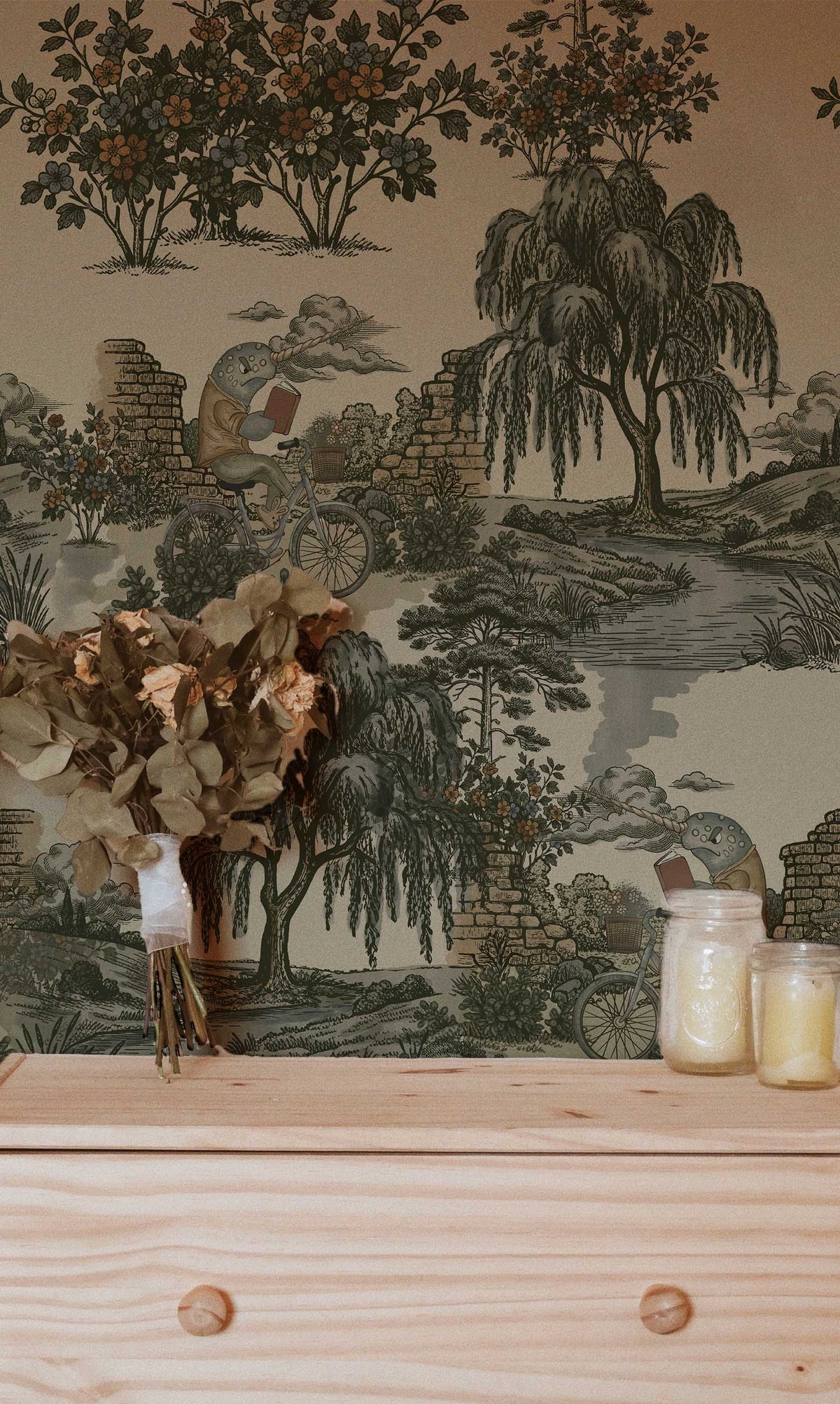 Grumpy Narwhal toile peel and stick wallpaper with vintage green woodland scenery and narwhals riding bicycles In bedroom.