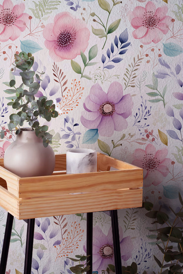 Watercolor floral wallpaper with pink and lavender botanicals on a soft cream background for Cottagecore interiors