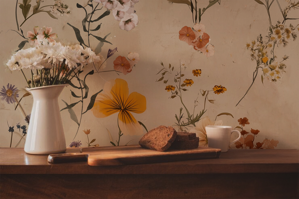 Neutral wildflower wallpaper with loose hand-painted stems, seed heads, and delicate blooms in muted taupe, cream, and sage on a warm off-white background in kitchen