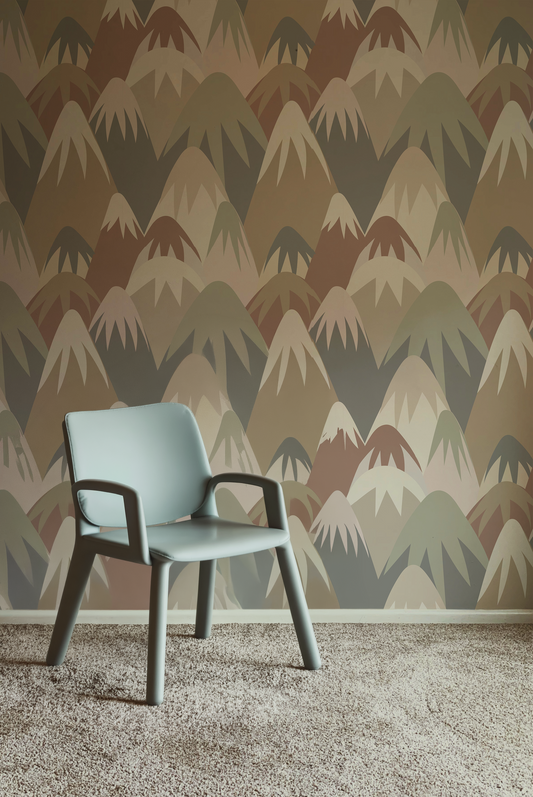 Retro mountain wallpaper featuring layered geometric mountain peaks in muted sage green, terracotta, taupe, cream, and brown tones, creating a playful mid-century modern landscape design in nursery