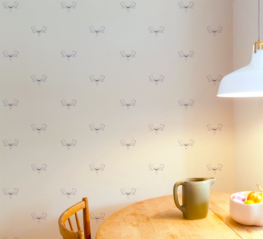 Minimal wallpaper with repeating moose head illustration wearing a top hat, subtle whimsical peel and stick wallpaper pattern in kitchen