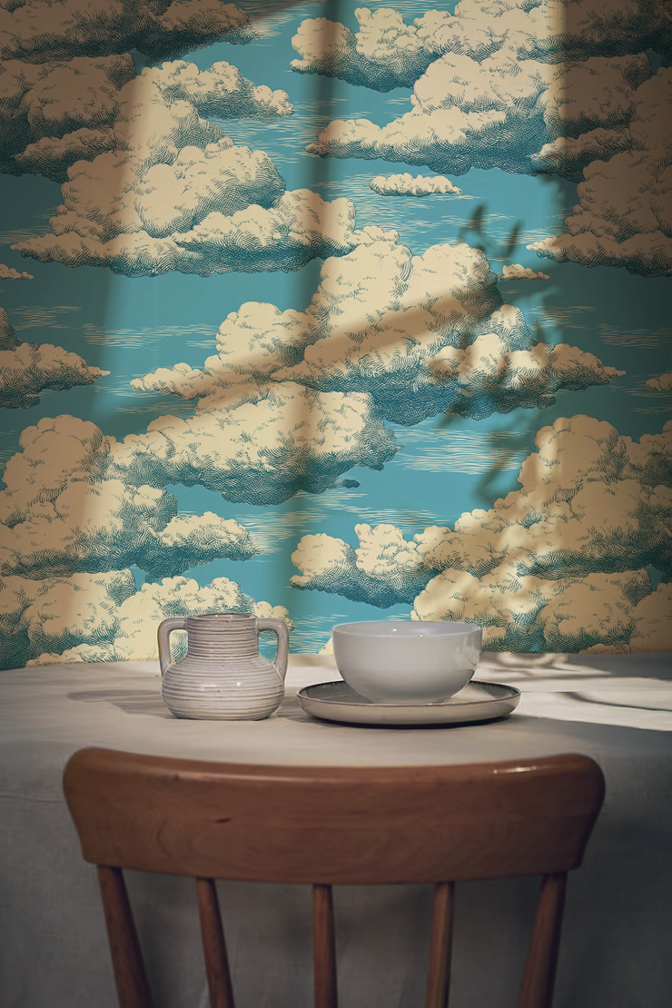 Vintage cloud sky wallpaper with fluffy white clouds drifting across a bright blue sky.