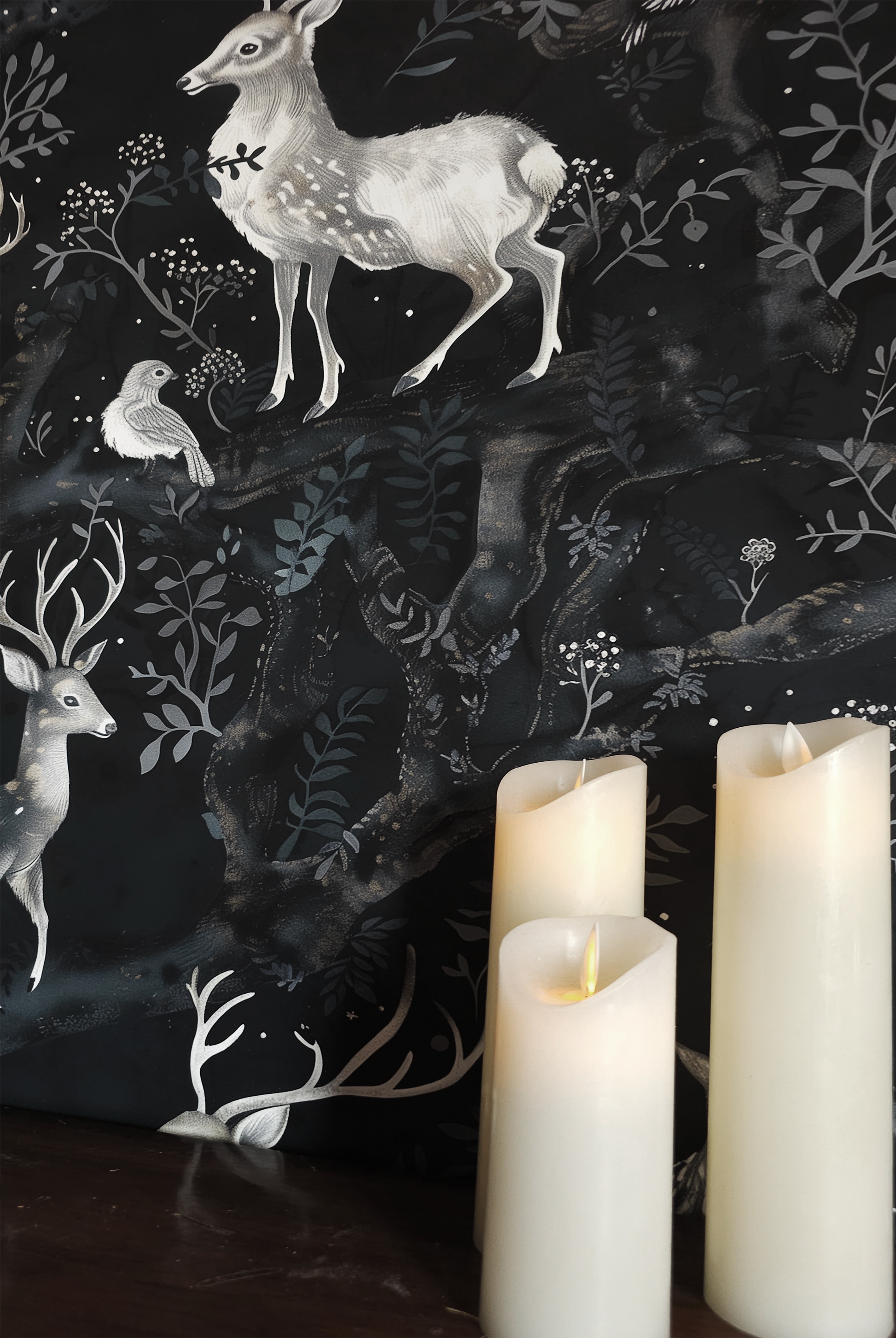 Dark woodland wallpaper featuring graceful deer, owls, and birds among twisting forest branches and soft botanical details on a deep moody background up close