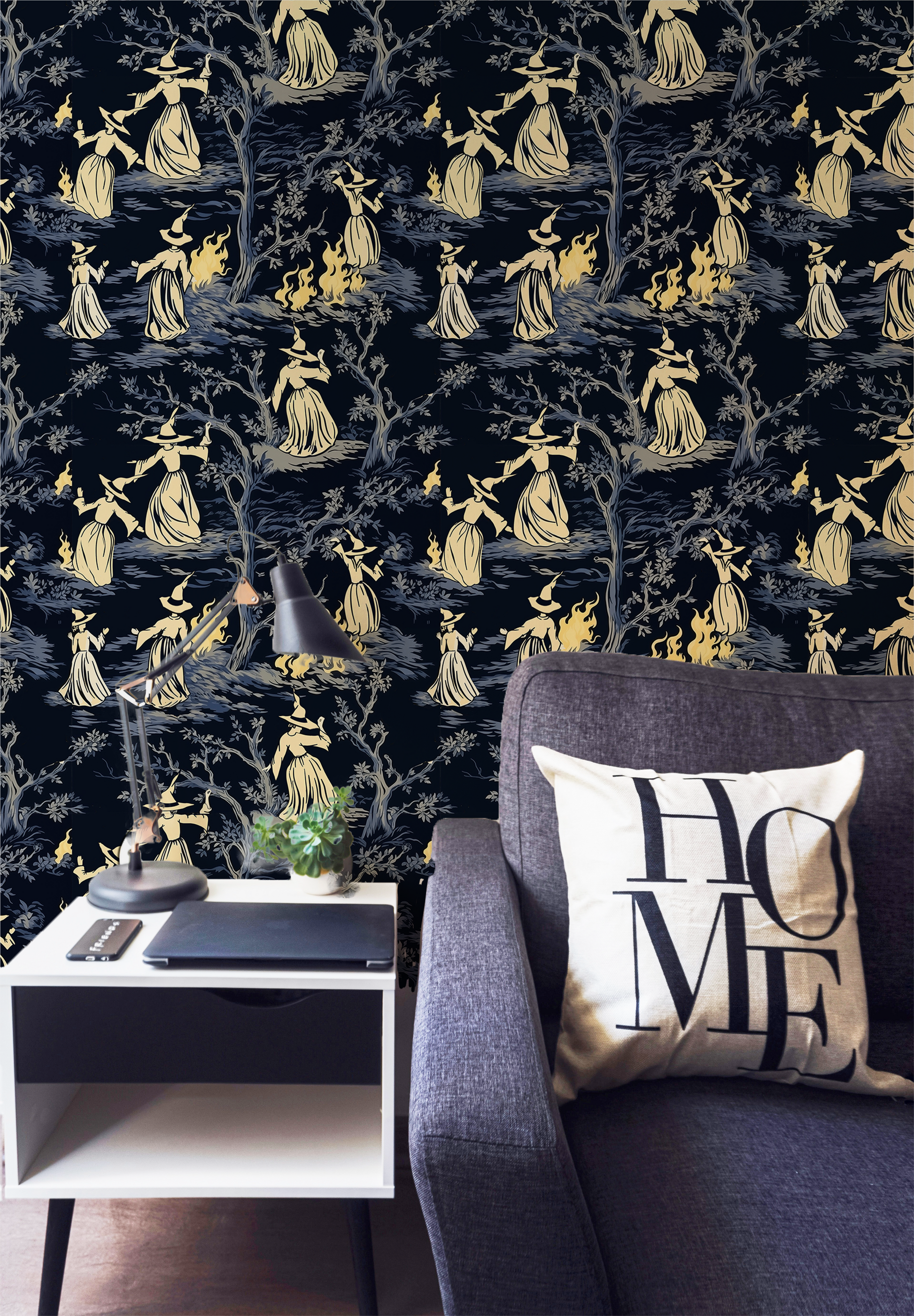 Dark navy witch toile wallpaper with vintage figures, trees, and bonfire scenes in gothic cottagecore style on wall