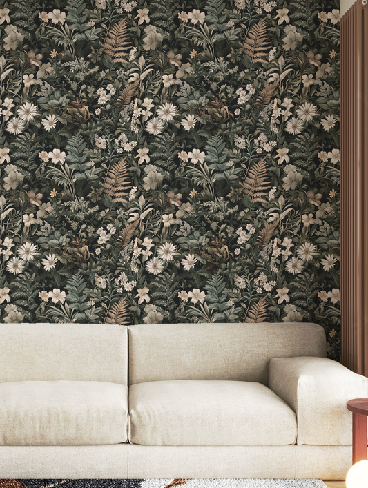 Dark green botanical wallpaper with dense vintage florals, ferns, and wildflowers in moody cottagecore style On wall