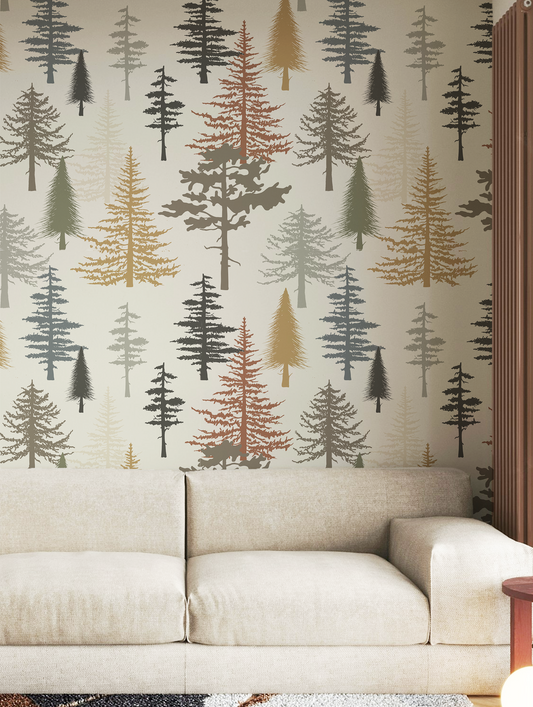 Forest tree wallpaper featuring stylized pine and evergreen trees in sage green, charcoal, taupe, mustard, and rust tones on a warm neutral background, inspired by woodland and cabin décor in living room