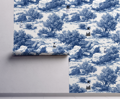 Blue toile peel and stick wallpaper with pastoral landscape, rocks and trees, whimsical ghost characters in vintage top hats repeat pattern