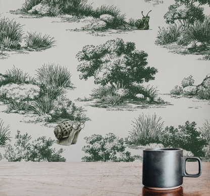 Vintage pastoral wallpaper with trees and grass landscape featuring snails wearing glasses, detailed toile style peel and stick wallpaper in kitchen