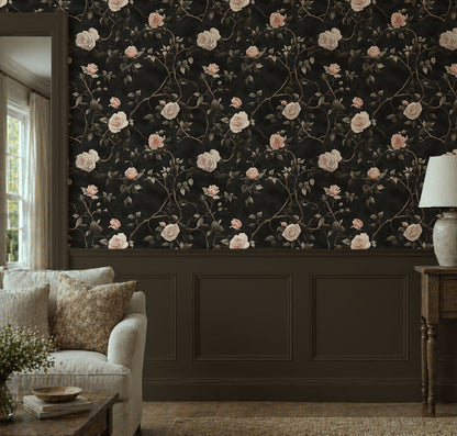 Dark floral wallpaper with ivory and blush roses climbing twisted vines on a moody black background in living room