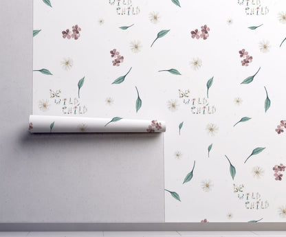 Soft floral nursery wallpaper with delicate wildflowers greenery and whimsical be wild child lettering on a neutral background in a cottagecore style