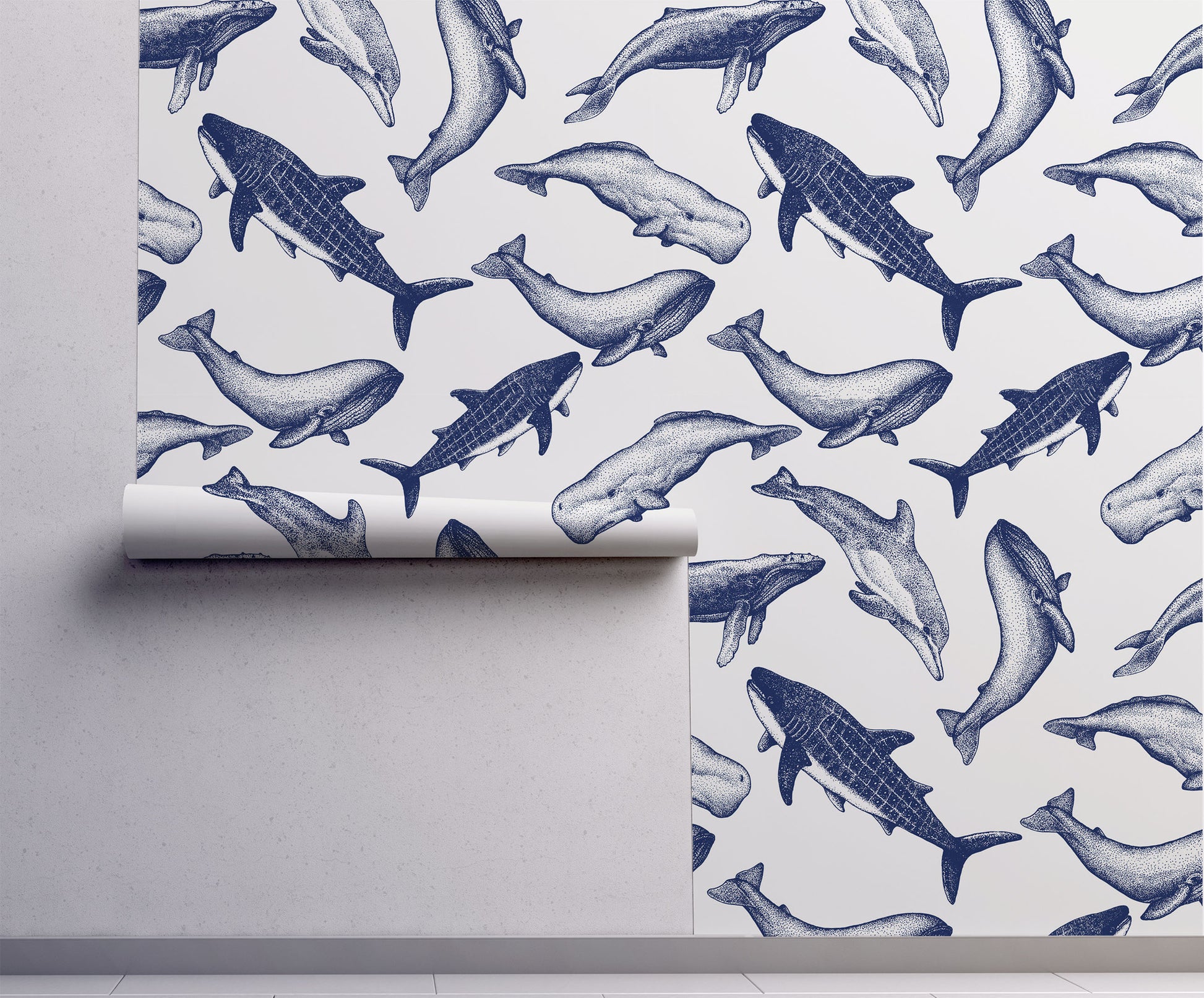 Coastal whale wallpaper with navy blue vintage style whale illustrations on a soft neutral background in a nautical cottage style interior