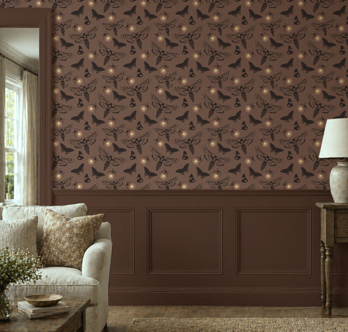 Dark cottagecore wallpaper featuring vintage death's head moths, butterflies, and glowing fireflies on a warm taupe background with peel and stick installation in living room 