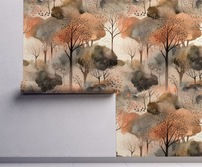Watercolor wallpaper featuring soft autumn forest trees with warm amber, burnt orange, and golden yellow foliage on a misty neutral background on wall