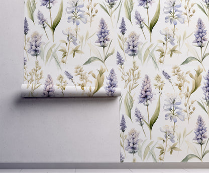 Lavender and blue botanical wallpaper featuring watercolor hyacinths and spring flowers on a soft cream background on wall