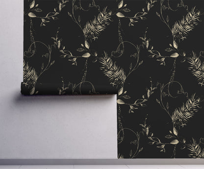 Black botanical wallpaper with vintage beige fern fronds, leafy branches and delicate curling vines on wall.