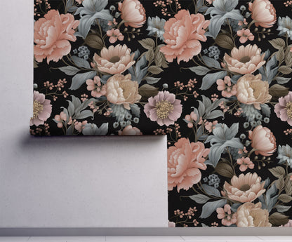 Moody blush floral wallpaper with oversized peonies and blue-gray botanical foliage on a black background on wall