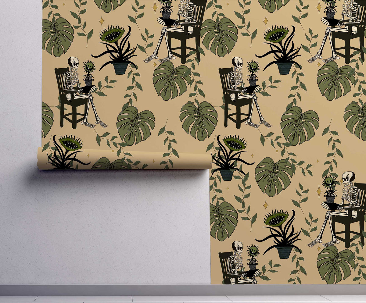 Whimsigoth skeleton botanical peel and stick wallpaper with vintage gardeners and tropical monstera leaves on a cream background On wall.