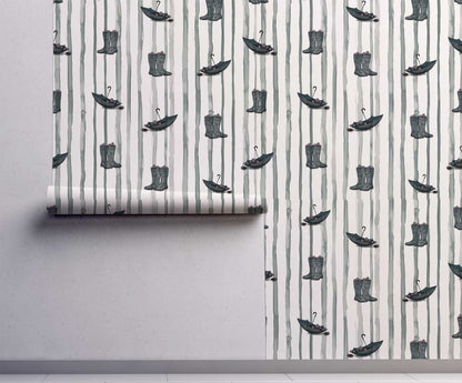Dance in the Rain peel and stick wallpaper with illustrated rain boots and umbrellas on soft vertical stripes On wall.