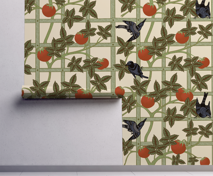 Vintage botanical wallpaper featuring black birds, red tomatoes and climbing green vines on a cream garden trellis on wall.