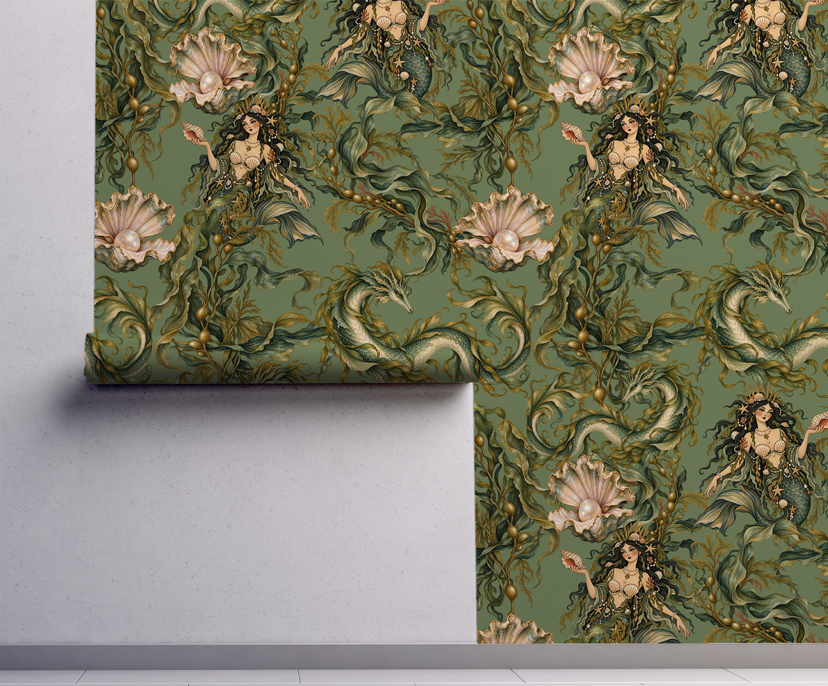 Moody green mythical sea life wallpaper featuring dark-haired sirens, curling sea serpents, flowing seaweed and blush pink oyster shells with pearls in a vintage botanical illustration style on wall.