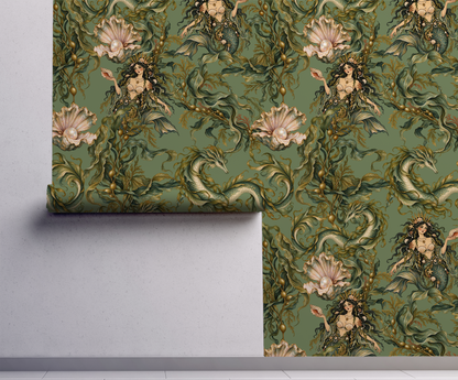 Moody green mythical sea life wallpaper featuring dark-haired sirens, curling sea serpents, flowing seaweed and blush pink oyster shells with pearls in a vintage botanical illustration style on wall.