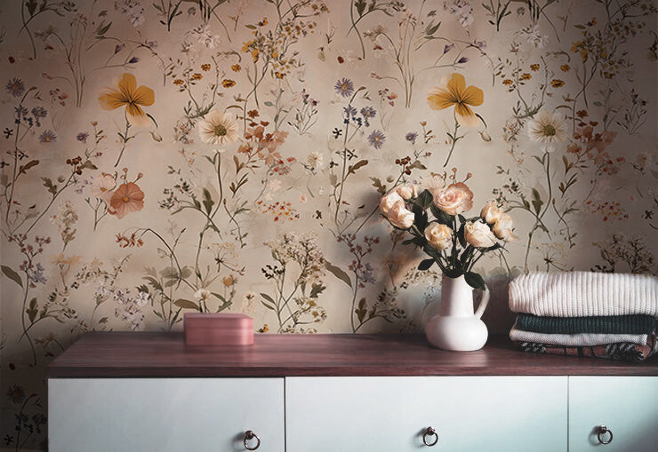 Light floral wallpaper with delicate wildflowers and botanical stems on a warm beige background, ideal for soft Cottagecore interiors and bedrooms
