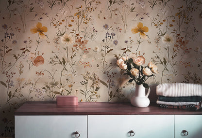 Light floral wallpaper with delicate wildflowers and botanical stems on a warm beige background, ideal for soft Cottagecore interiors and bedrooms

