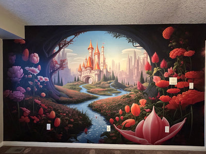 Fantasy castle wall mural featuring a whimsical fairytale kingdom, winding river, blooming flowers, enchanted forest archway, and storybook landscape in vibrant pink and blue tones.
