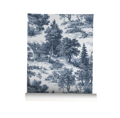 Wallpaper roll with a blue and white landscape design featuring trees and a house.