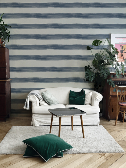 Watercolor striped wallpaper featuring wide hand-painted blue and white horizontal stripes, creating a relaxed coastal farmhouse look for bedrooms, beach houses, nurseries, and cottage-inspired interiors, in living room.