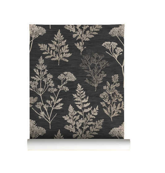 Roll of wallpaper with a neutral botanical pattern on a dark background