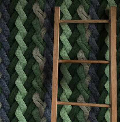 Evergreen cable knit wallpaper with braided knit pattern in layered green tones On wall