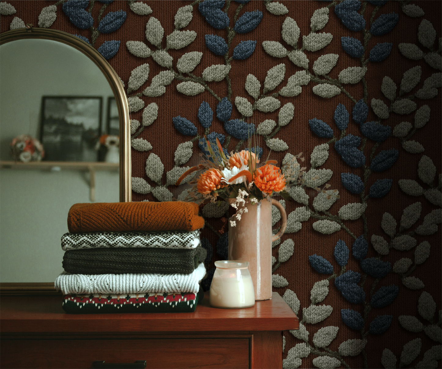 Textured botanical leaf wallpaper with blue and sage leaves on a warm rust background In room 