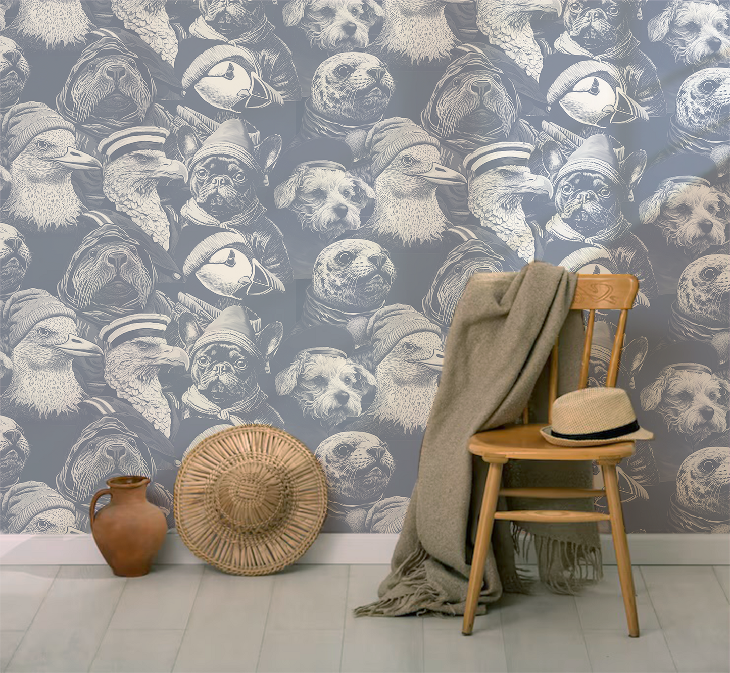 Blue peel-and-stick wallpaper sample featuring detailed illustrated animal portraits, including puffins, eagles, pugs, ducks, and sea otters wearing knit hats and sailor caps in a whimsical nautical style  with chair and hat